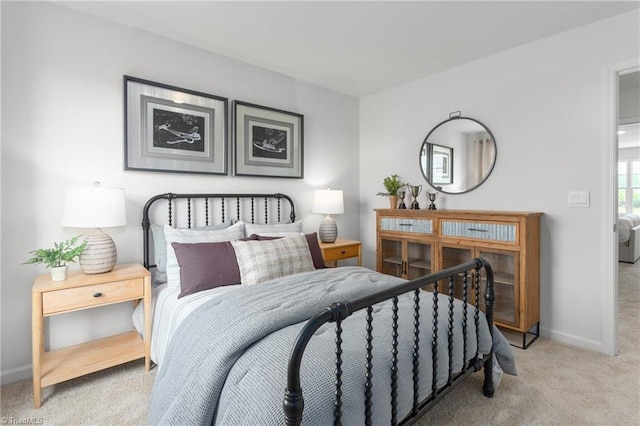 bedroom with light colored carpet