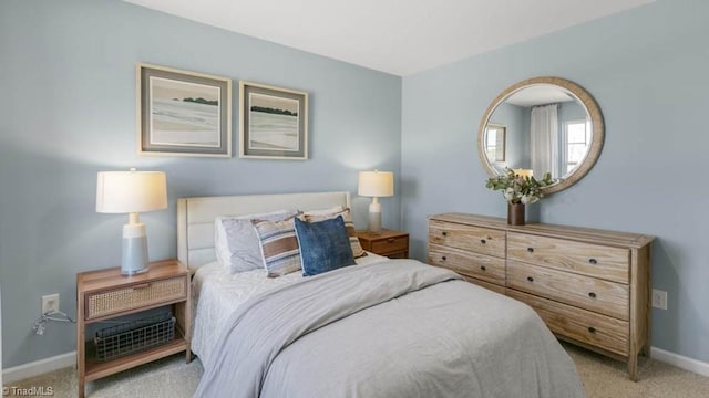 bedroom featuring light carpet