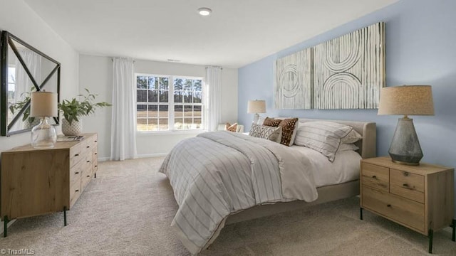 bedroom featuring light carpet