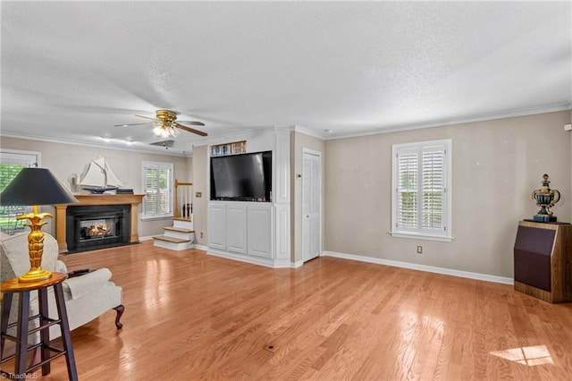 422 Wildwood Dr, Salisbury, NC 28146 - living area with light wood-style floors, a textured ceiling, a ceiling fan, and ornamental molding