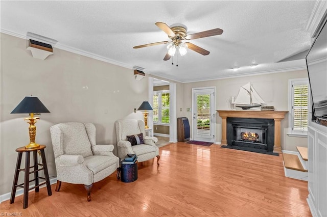 422 Wildwood Dr, Salisbury, NC 28146 - living area with a fireplace with flush hearth, ceiling fan, baseboards, and wood finished floors