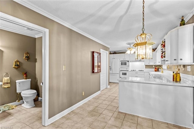 422 Wildwood Dr, Salisbury, NC 28146 - kitchen with a sink, white cabinetry, white appliances, ceiling fan, and ornamental molding