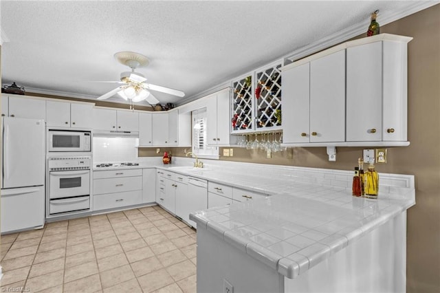 422 Wildwood Dr, Salisbury, NC 28146 - kitchen featuring a sink, a warming drawer, white appliances, ceiling fan, and tile countertops
