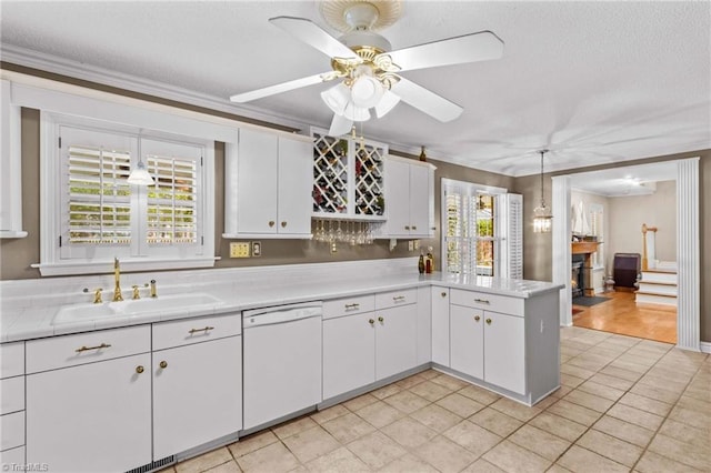 422 Wildwood Dr, Salisbury, NC 28146 - kitchen with dishwasher, ornamental molding, a sink, and a textured ceiling