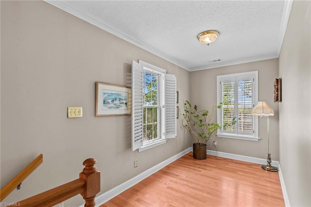422 Wildwood Dr, Salisbury, NC 28146 - spare room with baseboards, crown molding, wood finished floors, and a textured ceiling