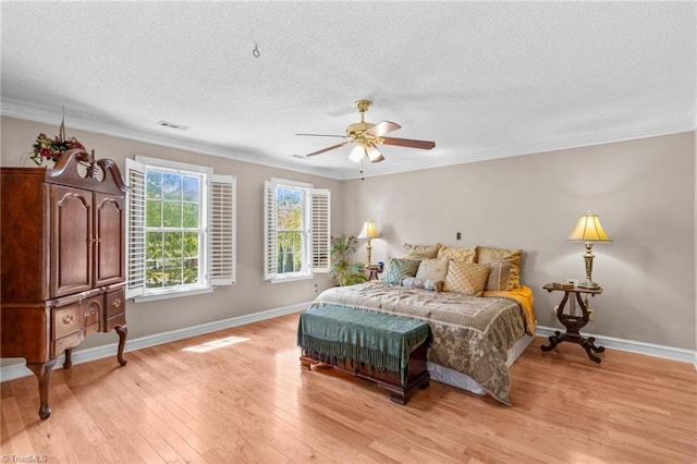 422 Wildwood Dr, Salisbury, NC 28146 - bedroom featuring crown molding, light wood finished floors, a textured ceiling, and visible vents