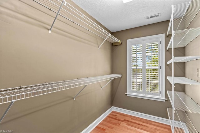422 Wildwood Dr, Salisbury, NC 28146 - spacious closet with wood finished floors and visible vents