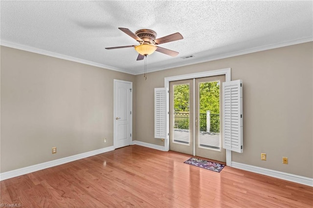 422 Wildwood Dr, Salisbury, NC 28146 - empty room featuring visible vents, wood finished floors, and a textured ceiling