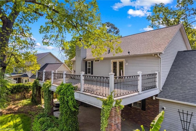 422 Wildwood Dr, Salisbury, NC 28146 - rear view of house with a shingled roof, a chimney, french doors, and a deck