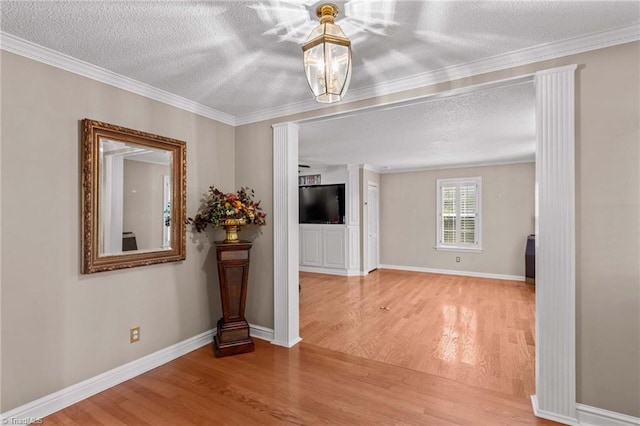 422 Wildwood Dr, Salisbury, NC 28146 - empty room with wood finished floors, a textured ceiling, and crown molding