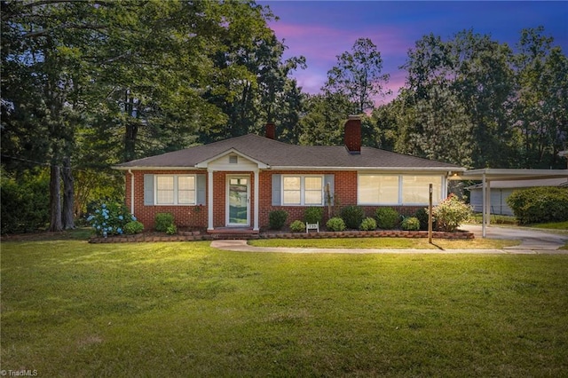 ranch-style house featuring a lawn