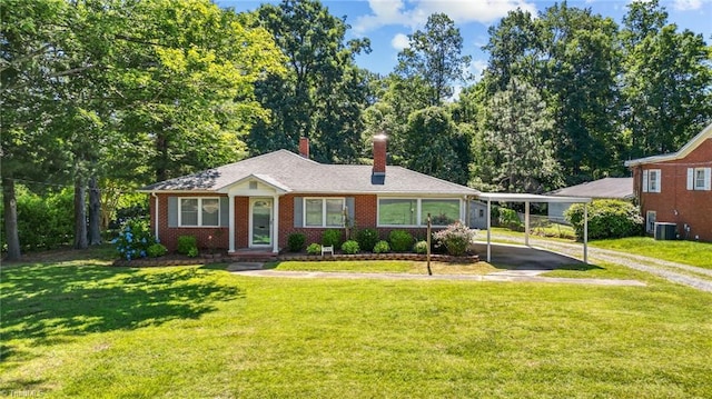 ranch-style house featuring a front lawn, a carport, and central air condition unit