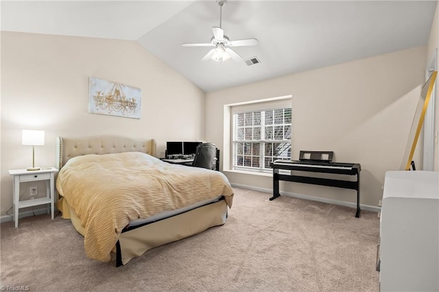 carpeted bedroom with ceiling fan and vaulted ceiling