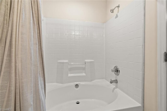 bathroom featuring shower / bathtub combination with curtain