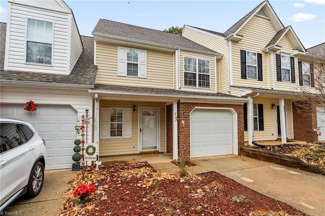 townhome / multi-family property featuring a garage