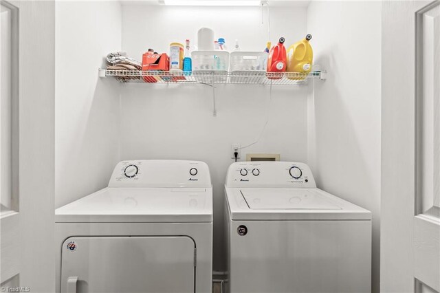 laundry area featuring washing machine and clothes dryer