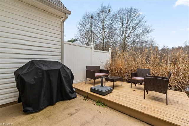 wooden deck with area for grilling