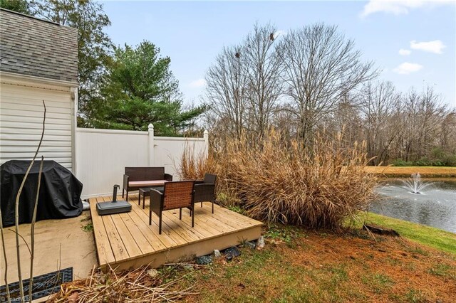 deck featuring outdoor lounge area and a grill