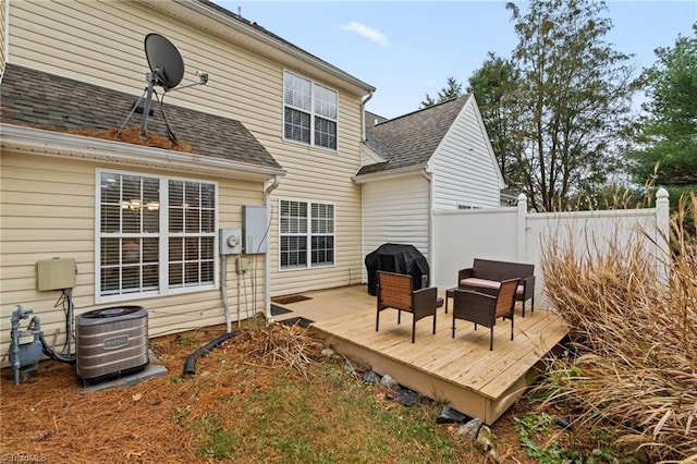 back of house with cooling unit and a wooden deck