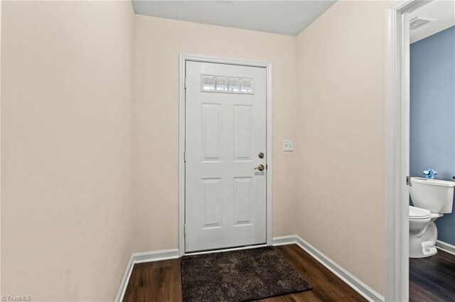 entryway with hardwood / wood-style floors