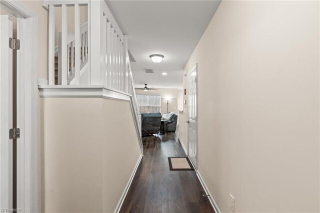 corridor with dark wood-type flooring