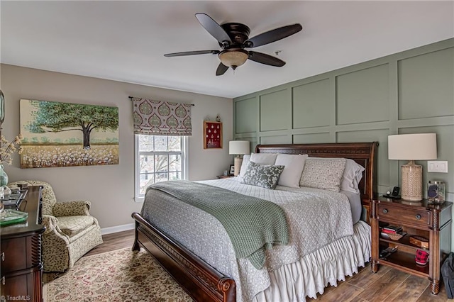 bedroom with ceiling fan and dark hardwood / wood-style flooring