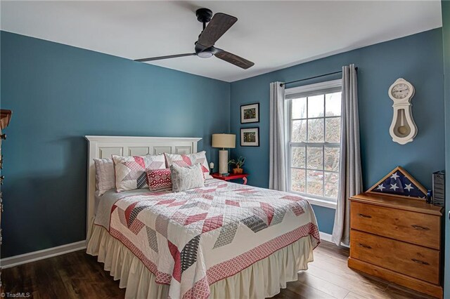 bedroom featuring ceiling fan and dark hardwood / wood-style flooring