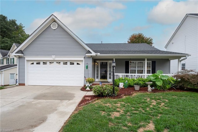 ranch-style home featuring a front lawn, a porch, and a garage