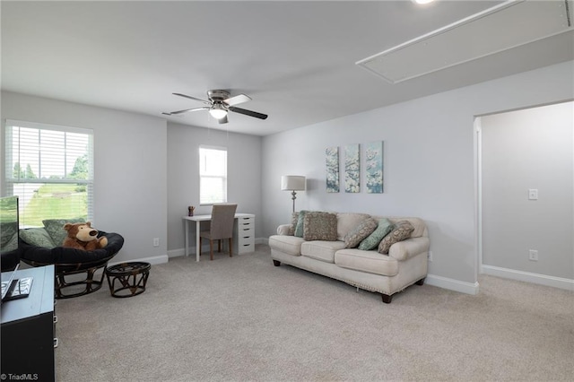 living room featuring light colored carpet and ceiling fan