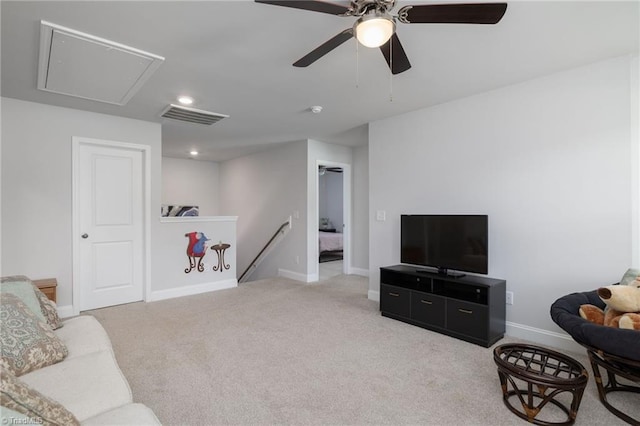 carpeted living room featuring recessed lighting, visible vents, attic access, ceiling fan, and baseboards