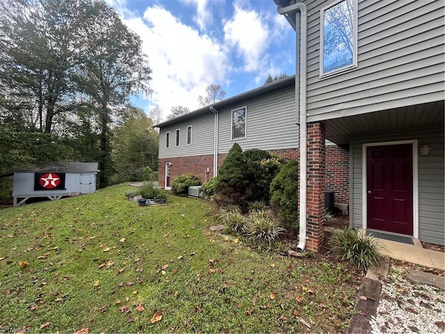 view of side of property with a yard