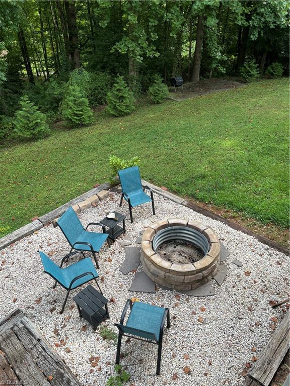 view of yard with a fire pit