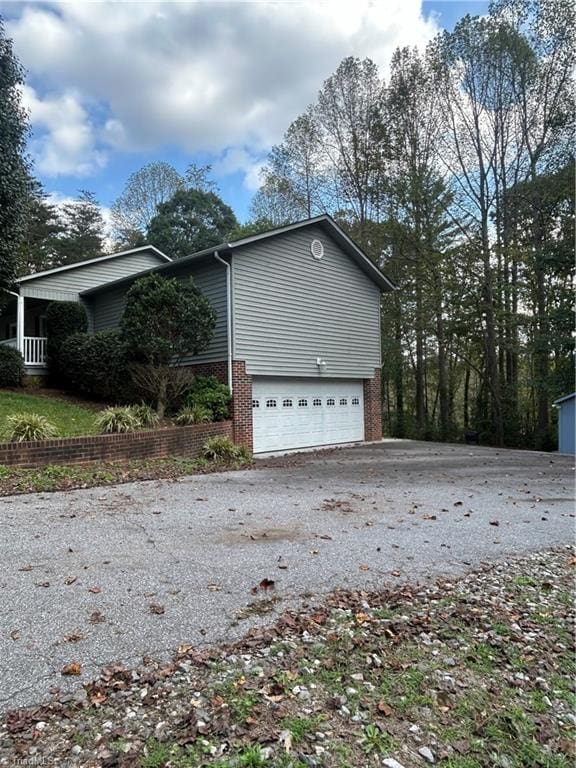 view of side of property featuring a garage