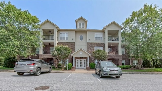 200 Lennox Dr Unit 3C, Jamestown, NC 27282 - view of building exterior with uncovered parking