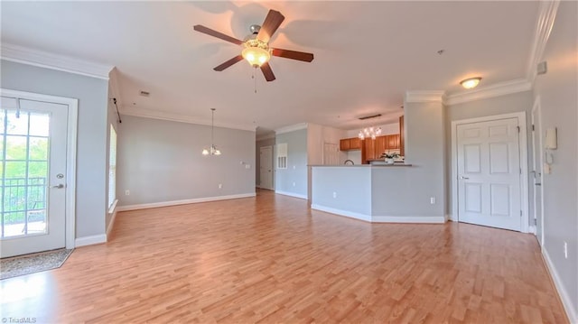 200 Lennox Dr Unit 3C, Jamestown, NC 27282 - unfurnished living room featuring a ceiling fan, light wood-style flooring, a chandelier, baseboards, and crown molding