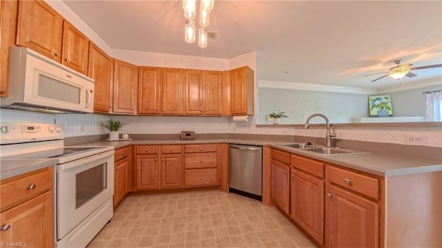 200 Lennox Dr Unit 3C, Jamestown, NC 27282 - kitchen featuring white appliances, a sink, a peninsula, ornamental molding, and brown cabinets