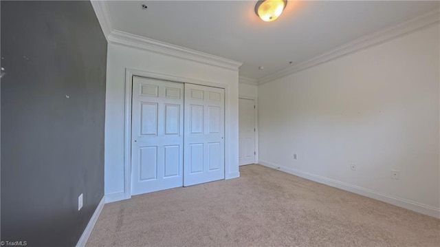 200 Lennox Dr Unit 3C, Jamestown, NC 27282 - unfurnished bedroom with crown molding, light colored carpet, a closet, and baseboards
