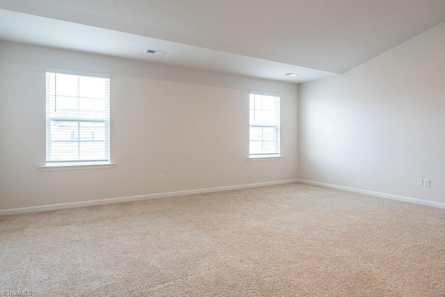 unfurnished room featuring carpet floors