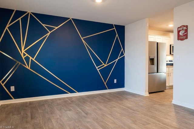 unfurnished room featuring light wood-type flooring