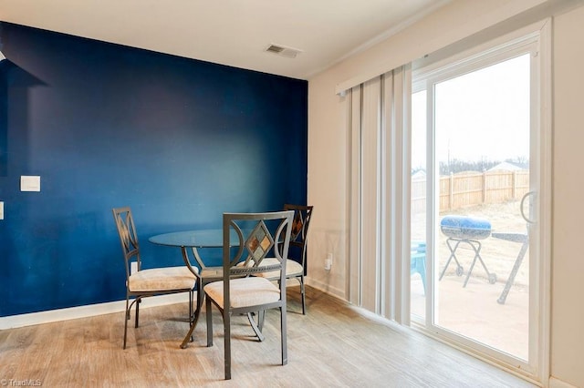 dining space featuring light hardwood / wood-style flooring