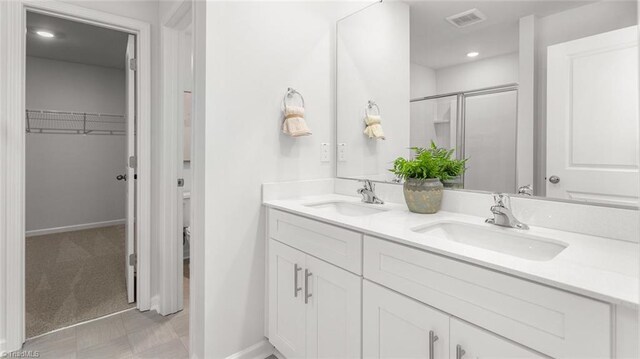 306 Willowbrooke Way, Stokesdale, NC 27357 - bathroom featuring vanity and an enclosed shower