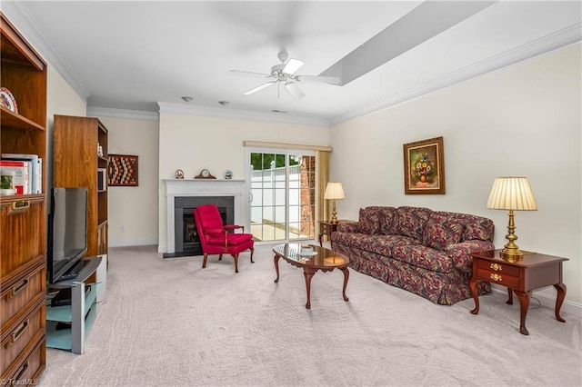 living room with baseboards, ornamental molding, ceiling fan, and light colored carpet