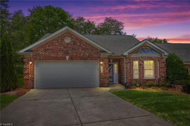view of front of property featuring brick siding, a garage, driveway, and a shingled roof