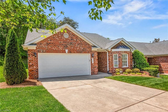 view of front of house with roof with shingles, an attached garage, driveway, and brick siding