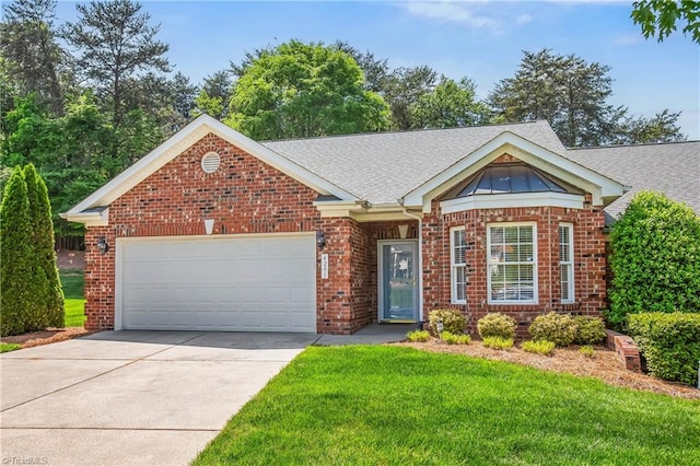 single story home with brick siding, an attached garage, driveway, and a front lawn