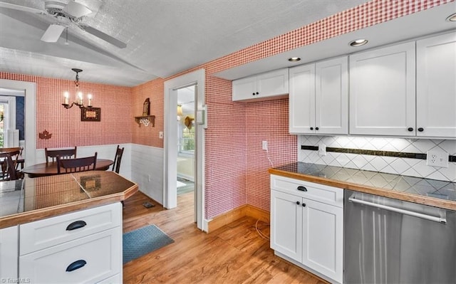 kitchen with white cabinets, light wood finished floors, and dishwasher