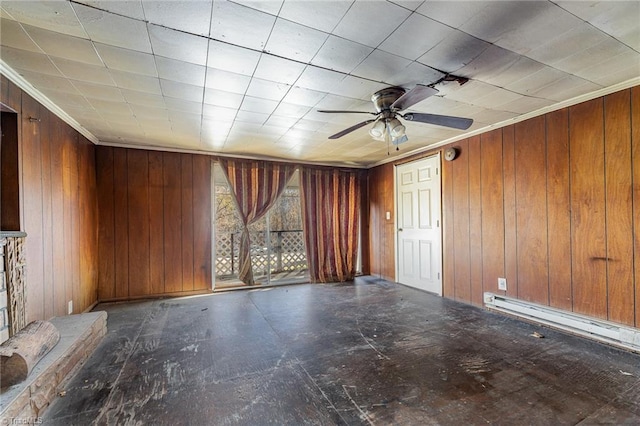 unfurnished room with ceiling fan, baseboard heating, and wooden walls