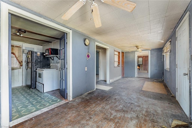 interior space with ceiling fan and dark hardwood / wood-style flooring