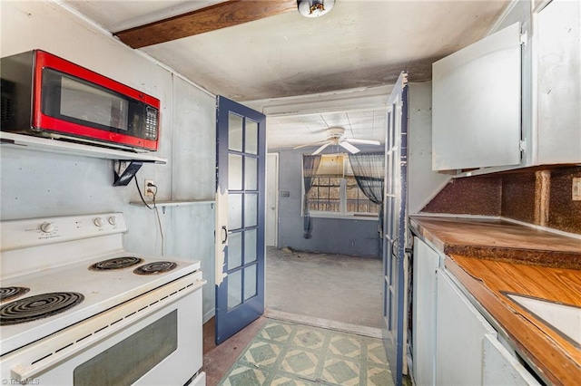 kitchen featuring white electric range oven, ceiling fan, wood counters, and white cabinetry