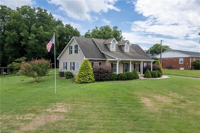 cape cod-style house with central AC and a front lawn